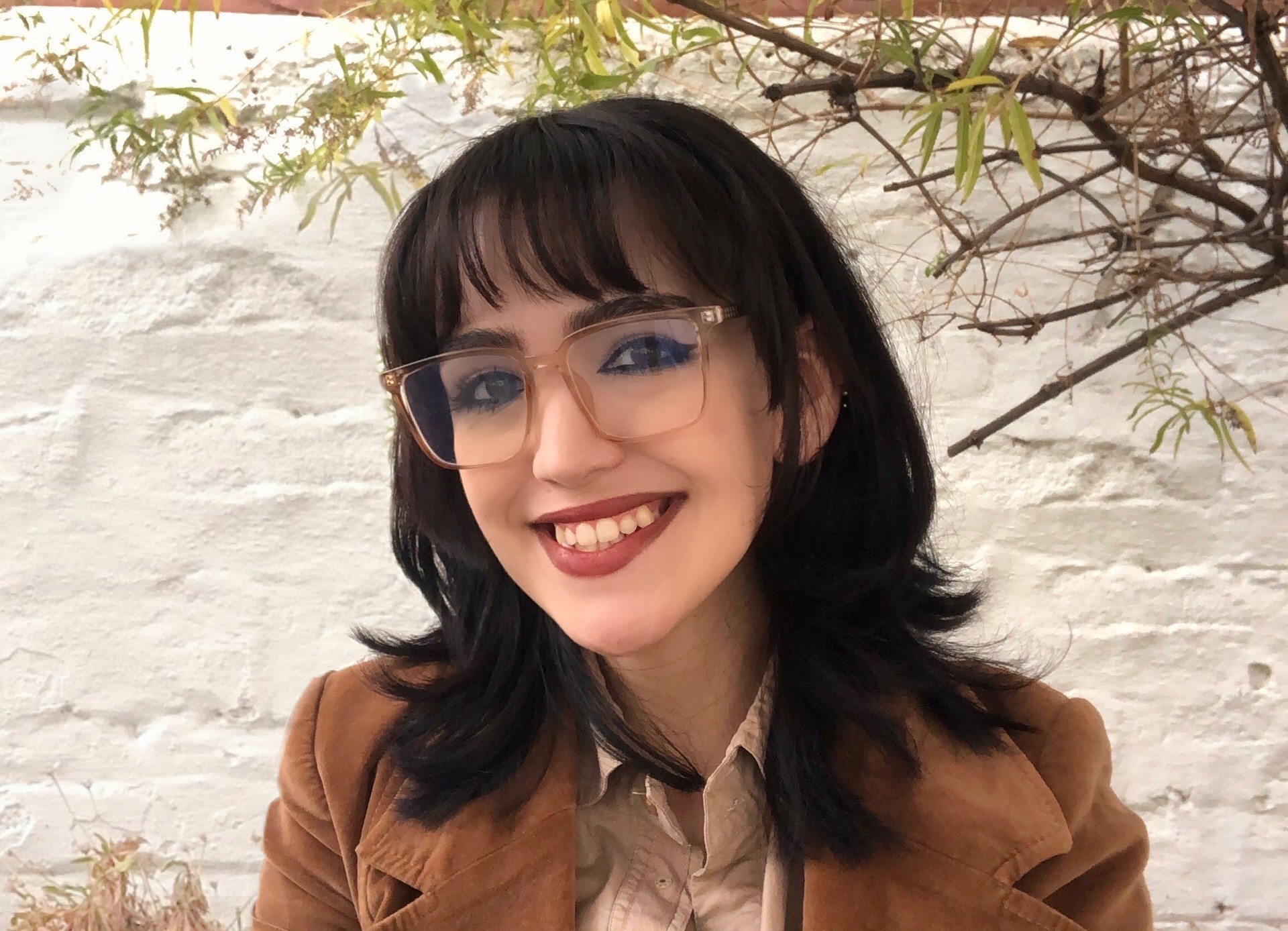 A professional headshot of Kiara Littlejohn smiling